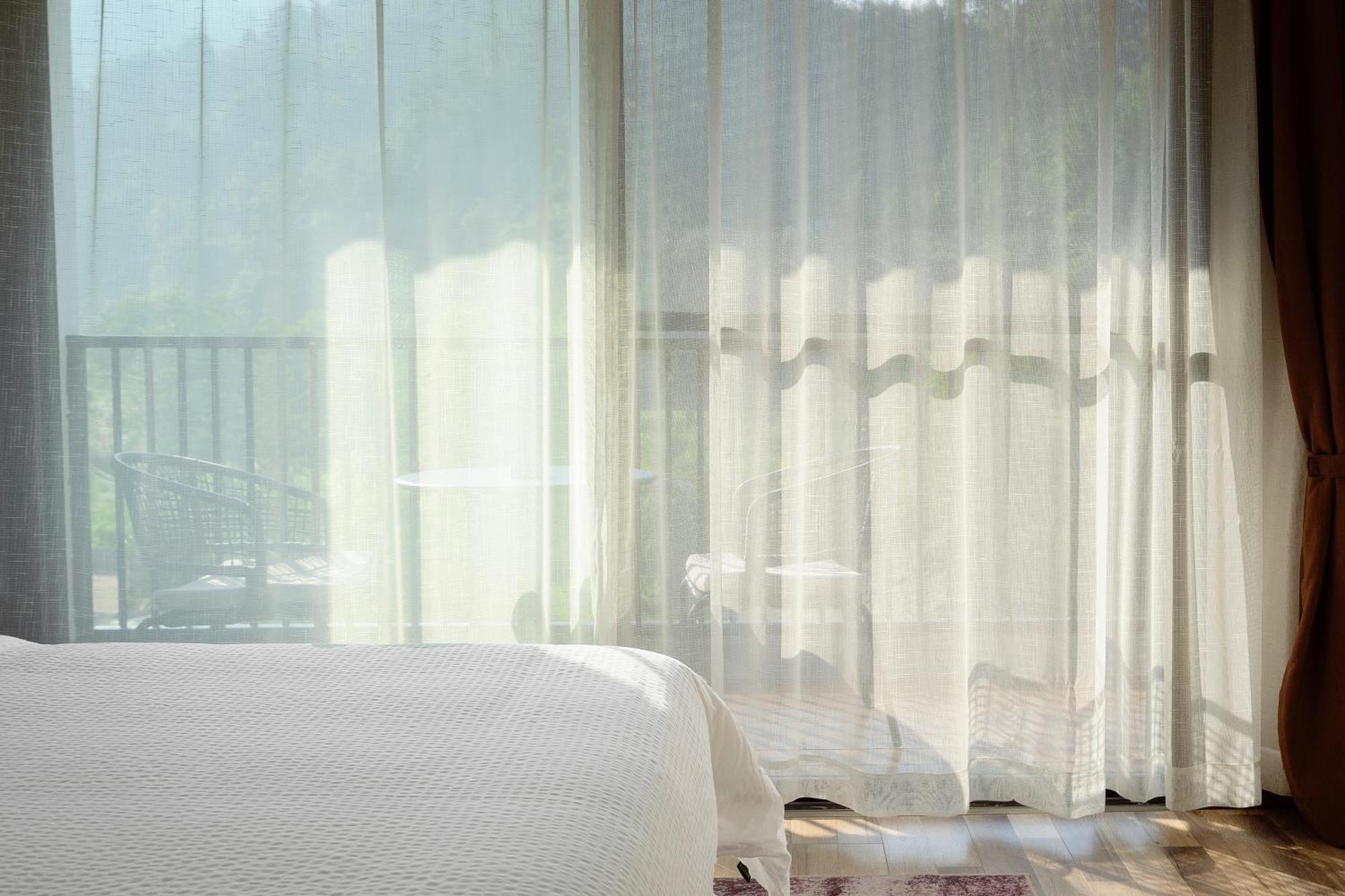 زانغجياجي Whispering Mountains Boutique Hotel المظهر الخارجي الصورة