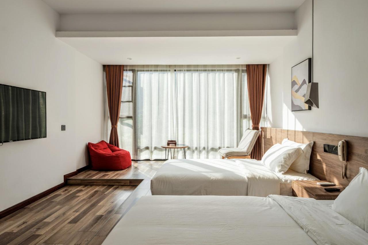 زانغجياجي Whispering Mountains Boutique Hotel المظهر الخارجي الصورة