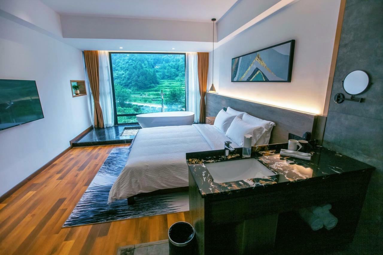 زانغجياجي Whispering Mountains Boutique Hotel المظهر الخارجي الصورة